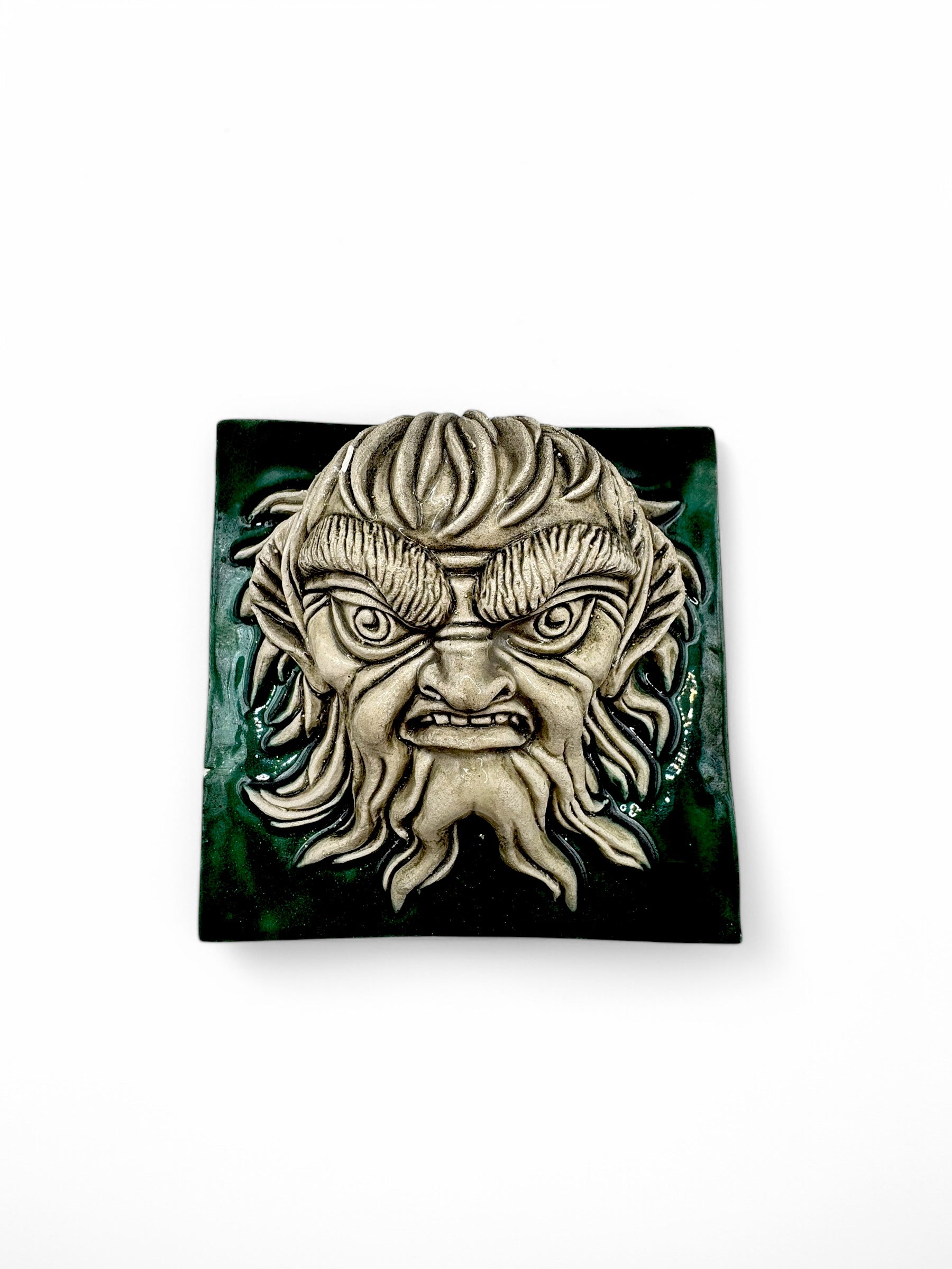 Azulejo artesanal en relieve Tritón